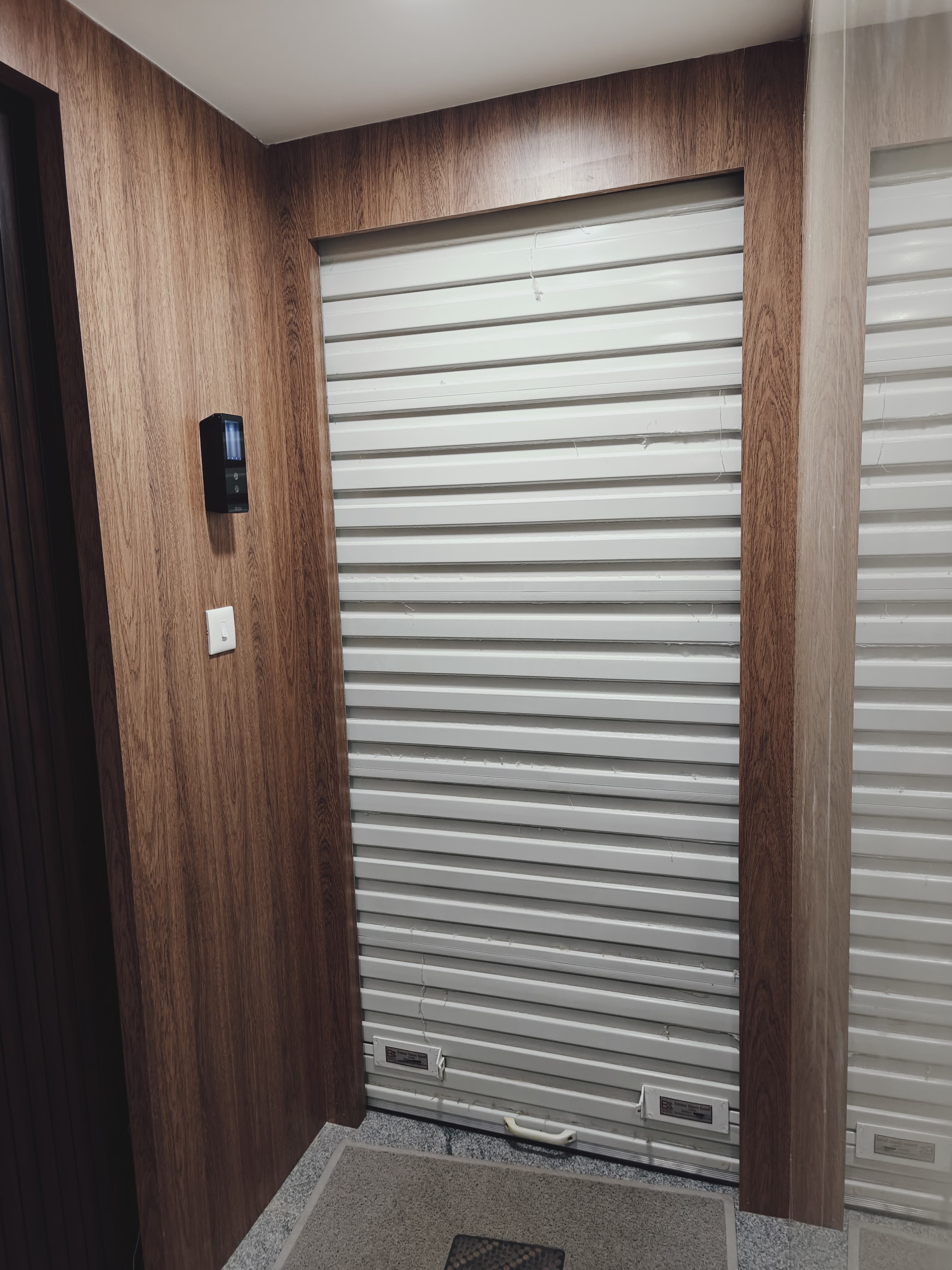 Installed white automated rolling shutter with electronic access control by Jayam Tech Engineering